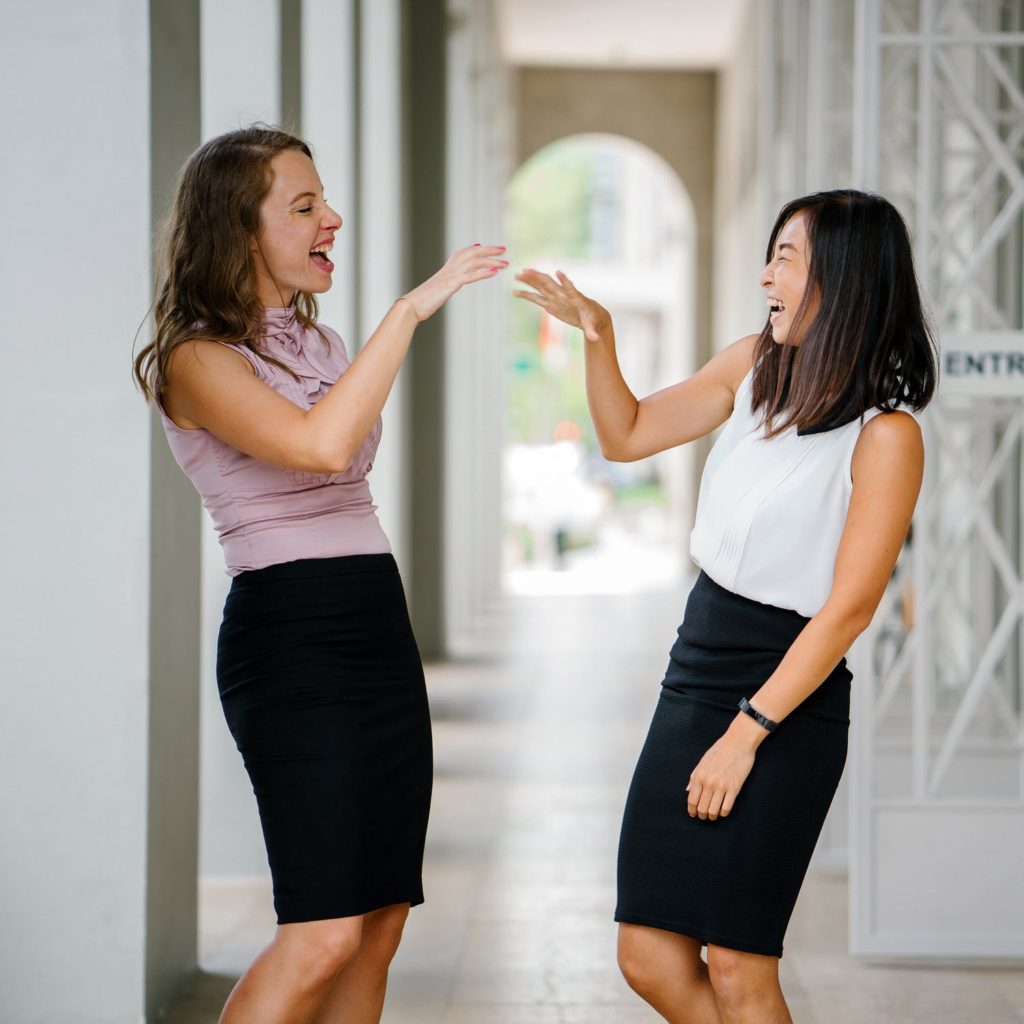 Two people practicing public speaking on each other in their everyday, normal lives