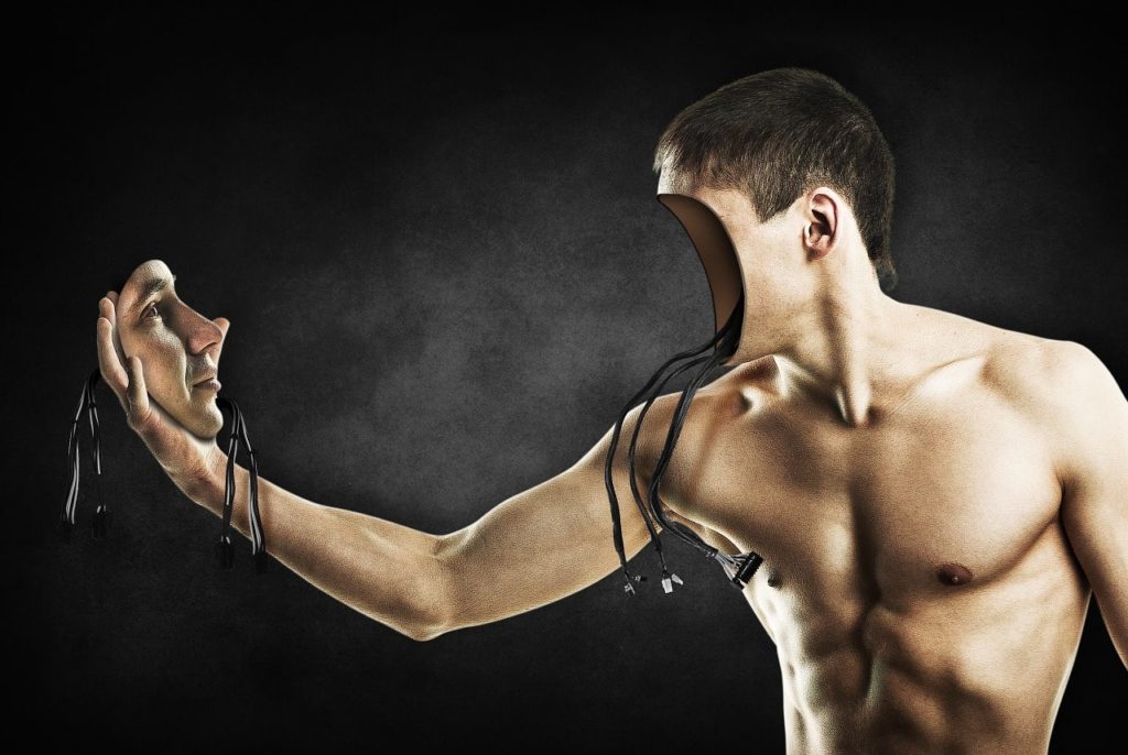 A metaphor-size image of a male splitting his face from his body to see his facial expressions.