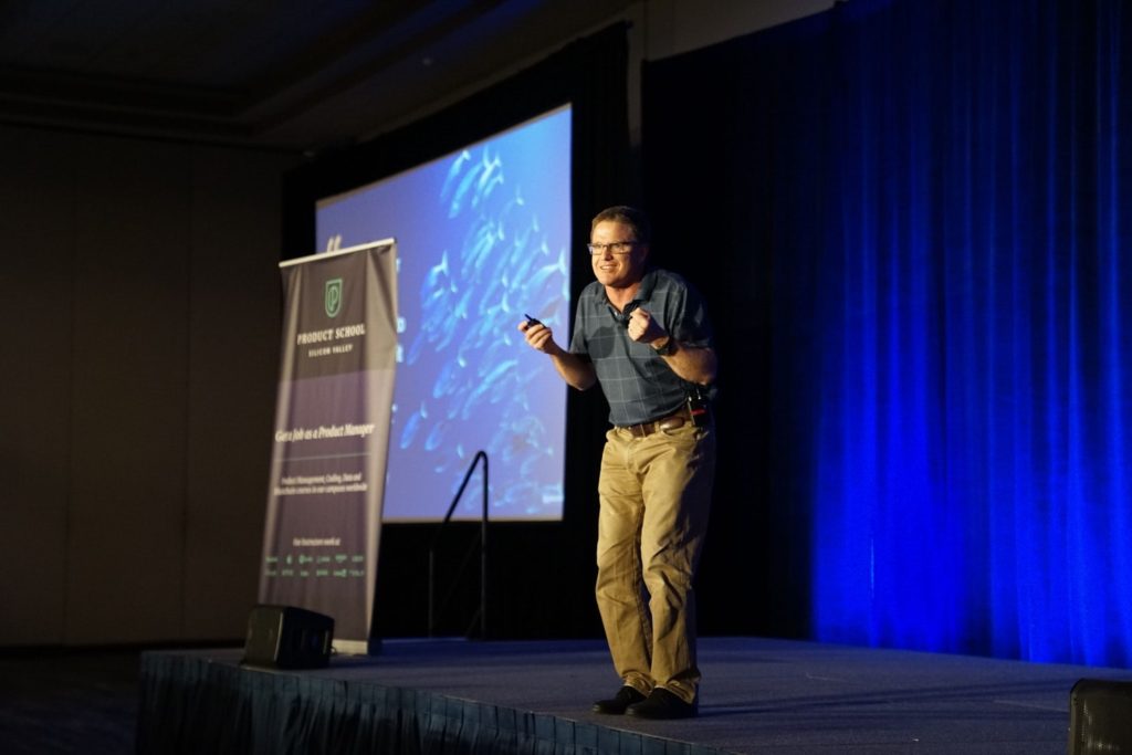 A speaker at an event making his speech flow with the help of effective transitions