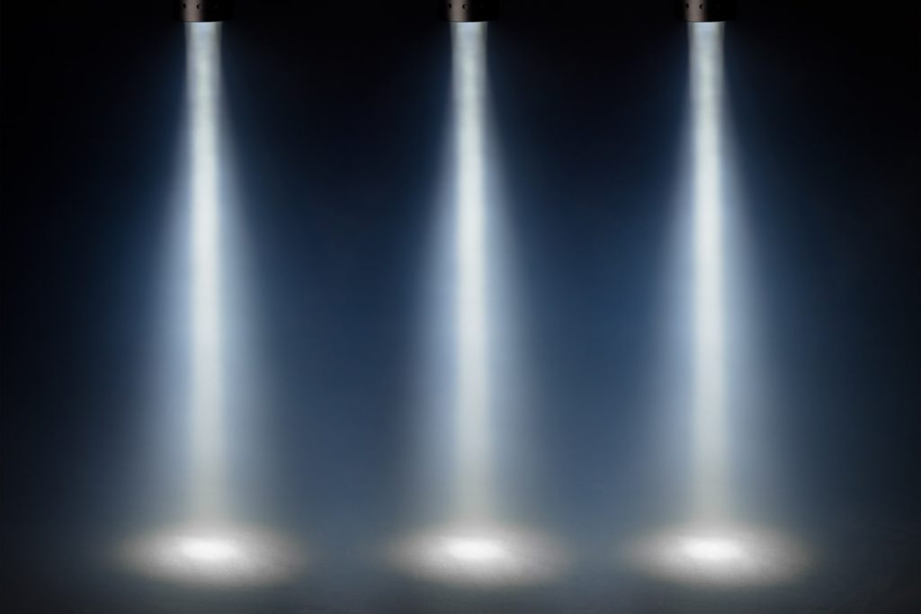 3 spotlights to emphasise the rule of three in speech writing