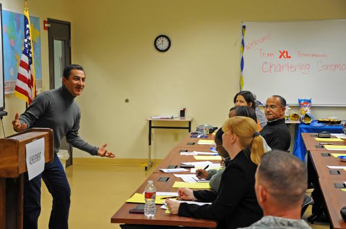 toastmaster delivering a speech at a meeting